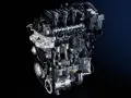 Sezione di un motore auto moderno, con pistoni, albero motore e distribuzione visibili.