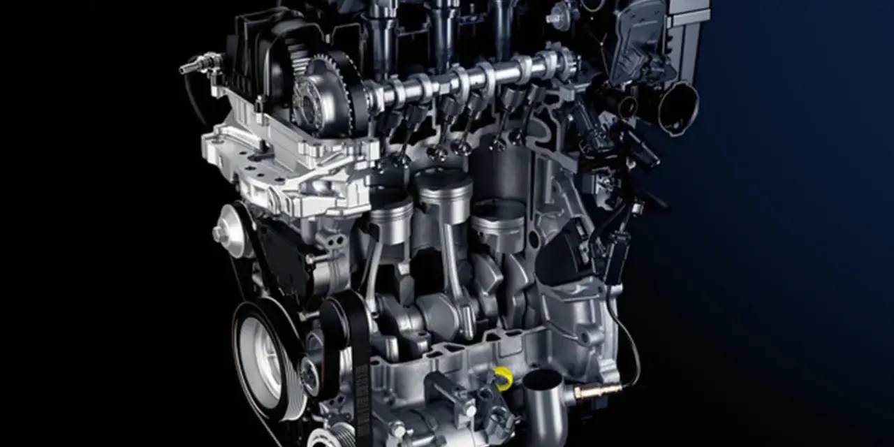 Sezione di un motore auto moderno, con pistoni, albero motore e distribuzione visibili.