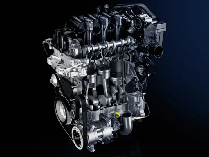 Sezione di un motore auto moderno, con pistoni, albero motore e distribuzione visibili.